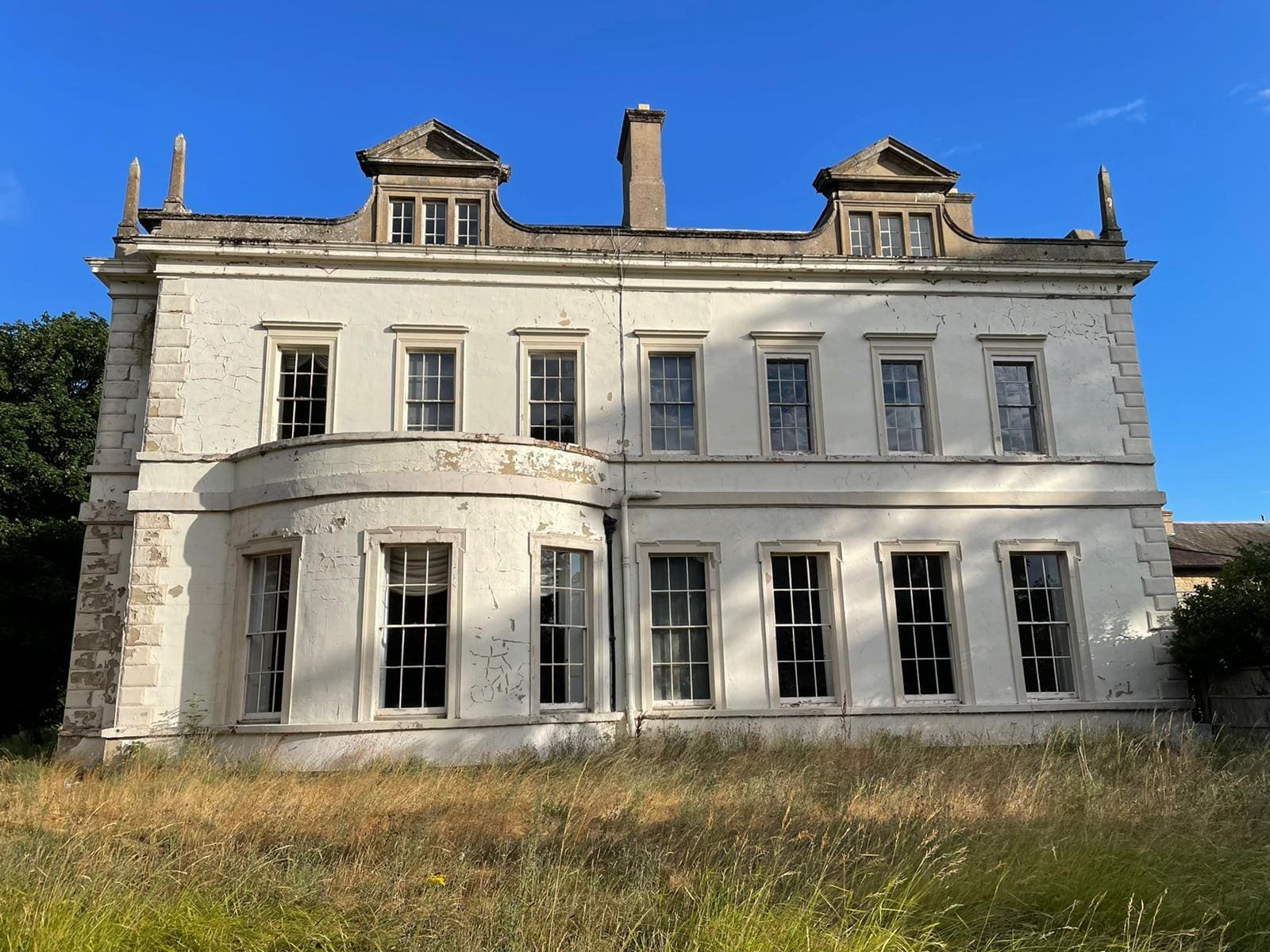 Historic Grade II listed building in East Sussex showing traditional stonework and period architecture